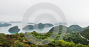 Panoramic view from mountain on rock islands with rainforest in Ha Long Bay near to Cat Ba, Vietnam