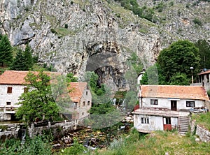 Panoramic view of the mountains, houses and Duman, the spring of the Bistrica River in the small town of Livno in Bosnia and