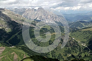 Panoramic view of mountains and meadows with trees in the Dolomites, South Tyrol, Italy