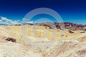 Panoramic view of mudstone and claystone badlands at Zabriskie Point. Death Valley National Park, California USA.