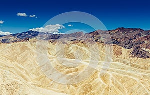 Panoramic view of mudstone and claystone badlands at Zabriskie Point. Death Valley National Park, California USA.