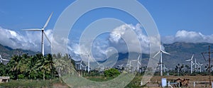 Panoramic view of Multiple wind mills in a field in India