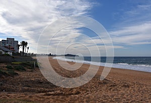 Panoramic view of Narrabeen beach on a cloudy day