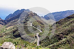Panoramic view on the narrow winding curvy mountain road to village Masca, Teno mountain massif, Tenerife. Roque de la Fortaleza