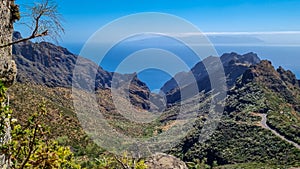 Panoramic view on the narrow winding curvy mountain road to village Masca, Teno mountain massif, Tenerife. Roque de la Fortaleza