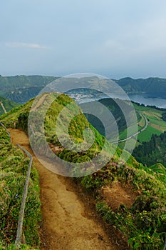 Panoramic view of natural landscape in the Azores, wonderful island of Portugal. Beautiful lagoons in volcanic craters and green f