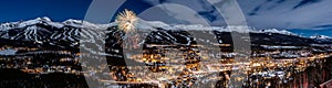 Panoramic view of New Year's Eve fireworks against snowy mountains in Breckenridge, Colorado