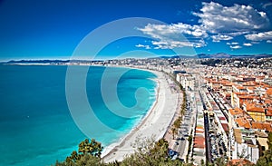 Panoramic view of Nice coastline and beach with blue sky.