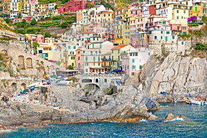 Scenic view of ocean and harbor in colorful village Vernazza, Ci