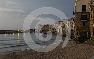 Panoramic view og CefalÃ¹ at golden hour from the beach