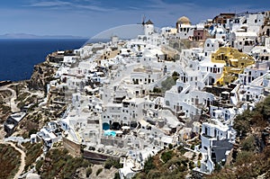 Panoramic view from Oia village with windmill on Santorini island, Greece