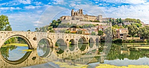 Panoramic view at the Old Bridge over Orb river with Cathedral of Saint Nazaire in Beziers - France