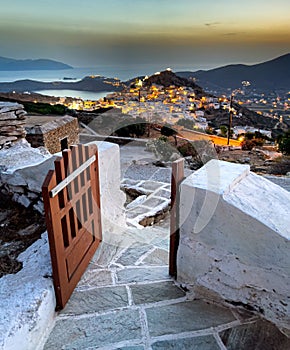 Panoramic view of the old city at sunset, beautiful gate, evening time night, cycladic islands, ios greece