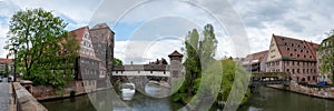 Panoramic view of old covered medieval bridge over Pegnitz river in Nuremberg, Germany