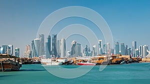 A panoramic view of the old dhow harbour timelapse in Doha, Qatar, with the West Bay skyline in the background.