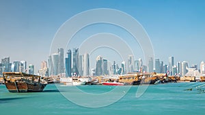 A panoramic view of the old dhow harbour timelapse in Doha, Qatar, with the West Bay skyline in the background.