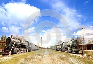 Panoramic view on an old railway with two trains