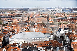 Panoramic view of Old Town in Bruges, Belgium. Red roofs, trees and quiet streets below.