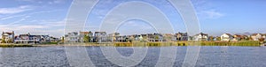 Panoramic view of Oquirrh Lake with homes and sky