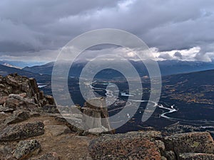 Panoramic view over Athabasca River Valley with small town Jasper, Alberta, Canada on cloudy day in autumn.