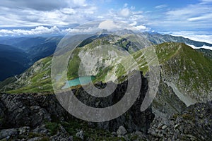 Panoramic view over Carpathian Mountains and glacier lake, Romania