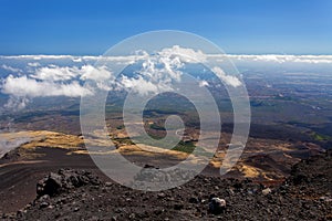 Panoramic view over the clouds from Etna at Mediterranean sea, Sicily, Italy