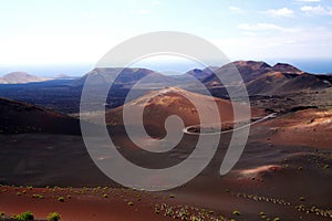 Panoramic view over endless surreal valley on volcanic cones and craters with blurred horizon - Timanfaya NP, Lanzarote