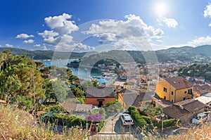 Panoramic view over Harbor and village Porto Azzurro, Elba islands, Italy