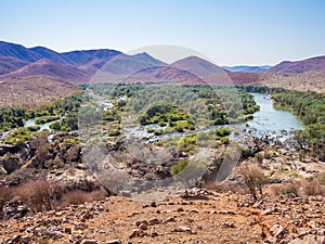 Panoramic view over Kunene River and Epupa Falls at border between Namibia and Angola, Africa