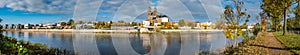Panoramic view over Magdeburg historical downtown, Elbe river, city park and the ancient medieval cathedral in golden Autumn