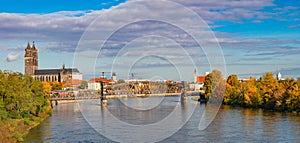 Panoramic view over Magdeburg historical downtown, Elbe river, city park and the ancient medieval cathedral in golden Autumn