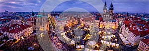 Panoramic view over the old town Prague during winter night time with a traditional Christmas Market