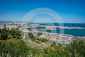 Panoramic view over Passeig de Colom, La Barceloneta, Port Vell marina, Christopher Columbus monument in Barcelona city, Catalonia