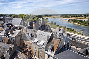 Panoramic view over roofs toward historic city center of Amboise with Loire river on the background, Loire valley, France.