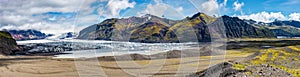 Panoramic view over Skaftafellsjokull glacier and tourists, a wander near Skaftafell on South Iceland, summer