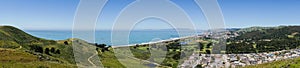 Panoramic view of Pacifica coastline as seen from the top of Mori Point, Marin County in the background, California photo