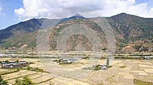 Panoramic view of paddy fields at the foothill of a mountain range