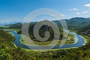 Panoramic view at Pavlova Strana on the river of Crnojevi?a flowing through green lands to Lake Skadar