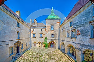 Panoramic view on the pebbled inner courtyard of historic Olesko Castle, Ukraine