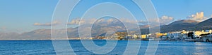 Panoramic view of picturesque harbor of resort village Hersonissos, Greek island of Crete
