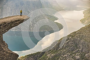 Panoramic view of picturesque view of Trolltunga and the fjord underneath photo