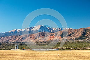 Panoramic view of Pikes Peak with air traffic control tower and rock formations