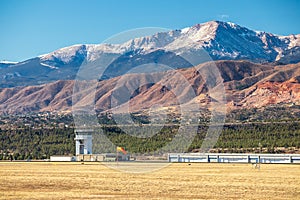 Panoramic view of Pikes Peak with air traffic control tower and rock formations