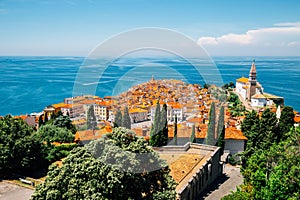 Panoramic view of Piran old town and Adriatic sea with St. George`s Parish Church in Slovenia photo
