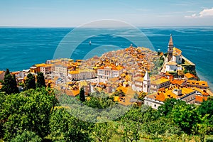 Panoramic view of Piran old town and Adriatic sea with St. George`s Parish Church in Slovenia photo