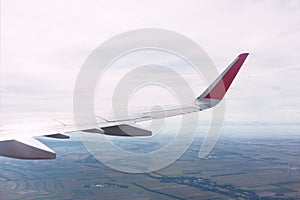 Panoramic view of plane wing durring flying