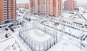 Panoramic view of playground hockey stadium and high-rise building facade exterior mixed-use urban multi-family