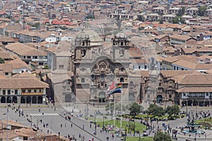 Panoramic view of plaza de armas and a catholic church facade