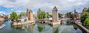 Panoramic view on The Ponts Couverts in Strasbourg with blue cloudy sky. France