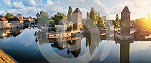 Panoramic view on The Ponts Couverts in Strasbourg with blue cloudy sky. France